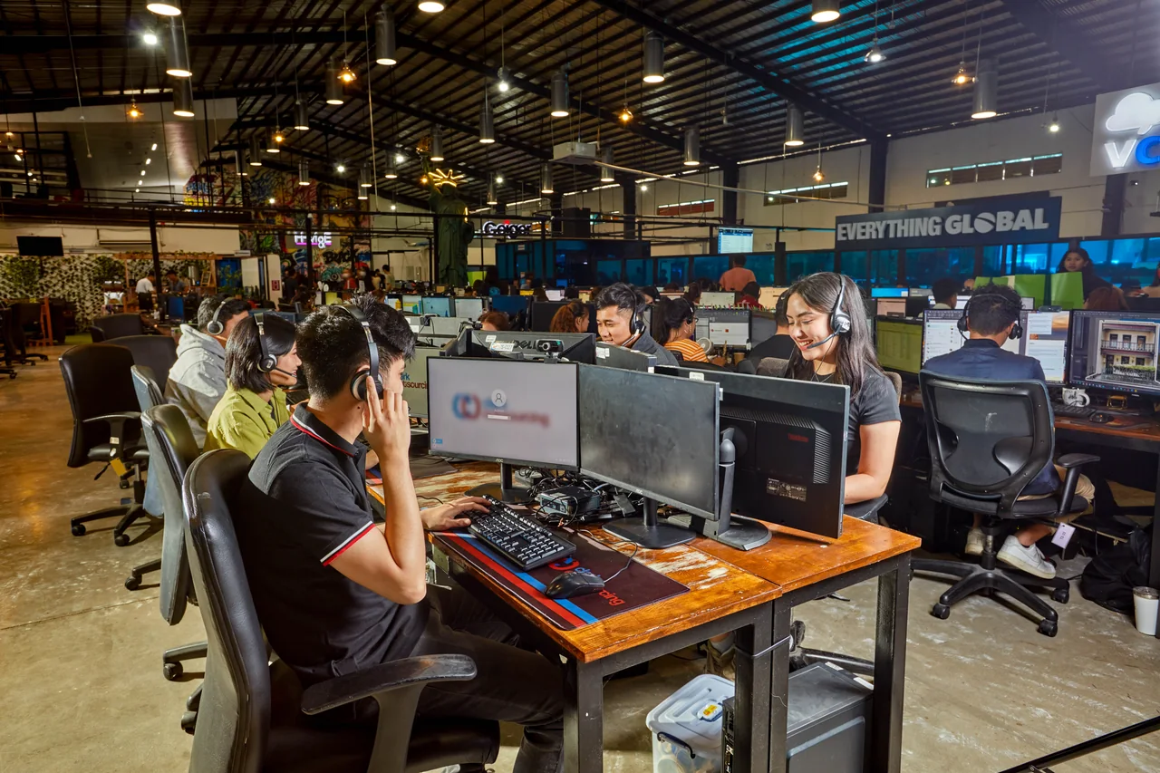 Clinical Intake Specialist outsourcing in the Philippines — team members using headsets at desktop workstations viewed from the opposite aisle