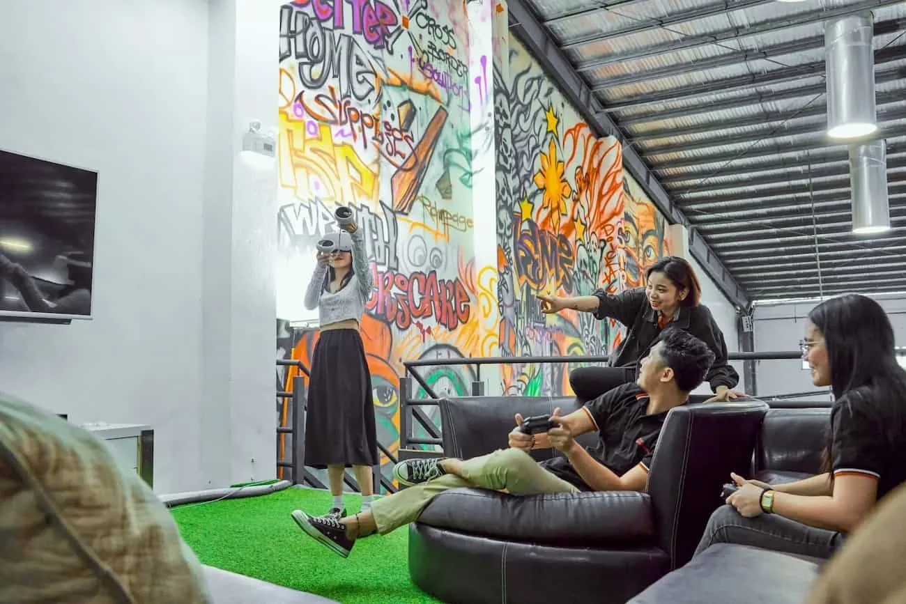 Colleagues talking in a lounge at the Clark Outsourcing office