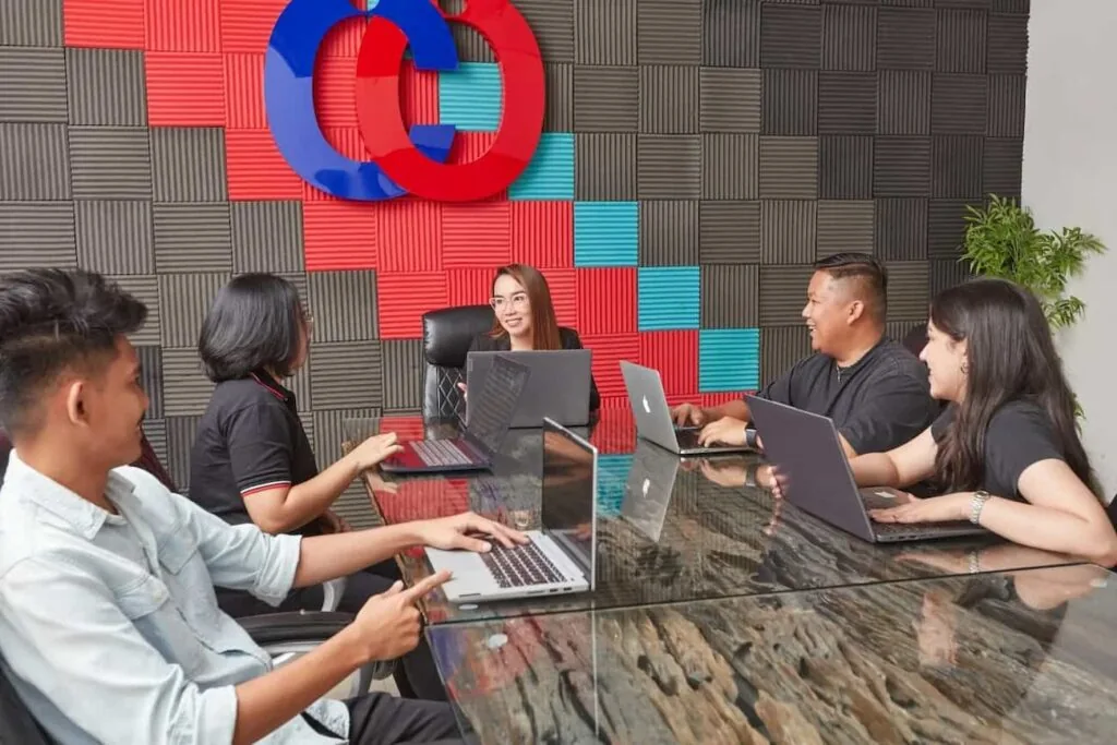 Clark Outsourcing colleagues collaborating around a meeting table