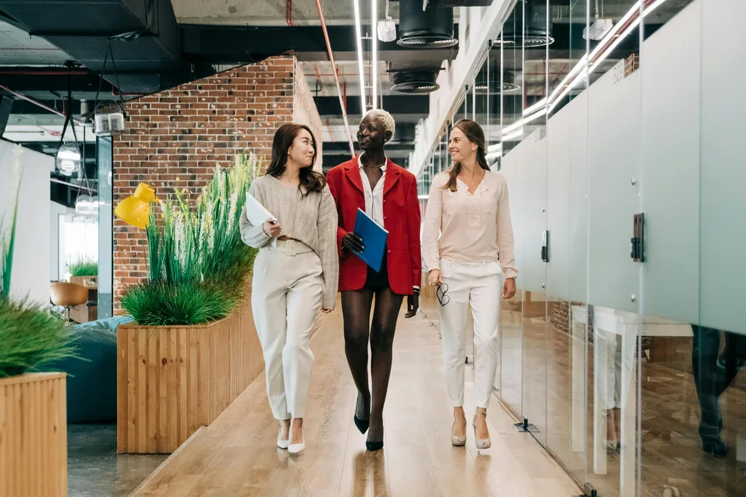 Colleagues walking through an office corridor