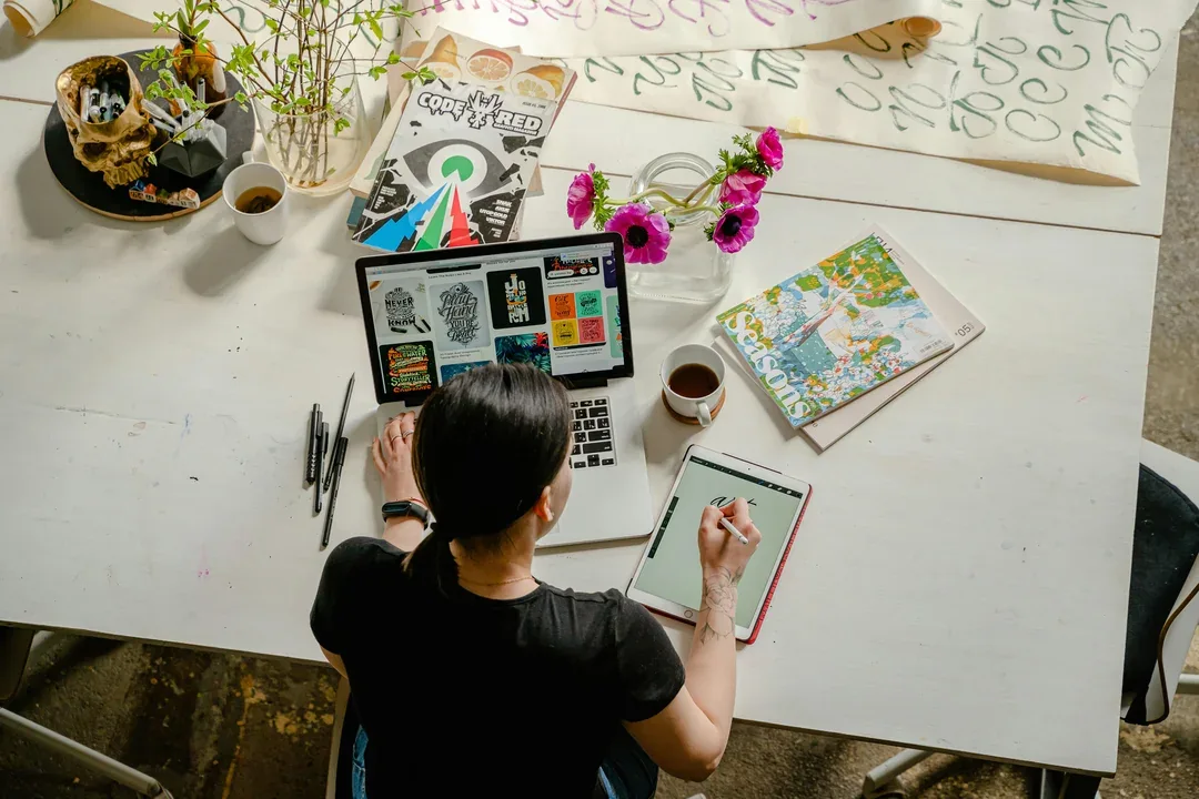 Designer reviewing visual concepts on a wall