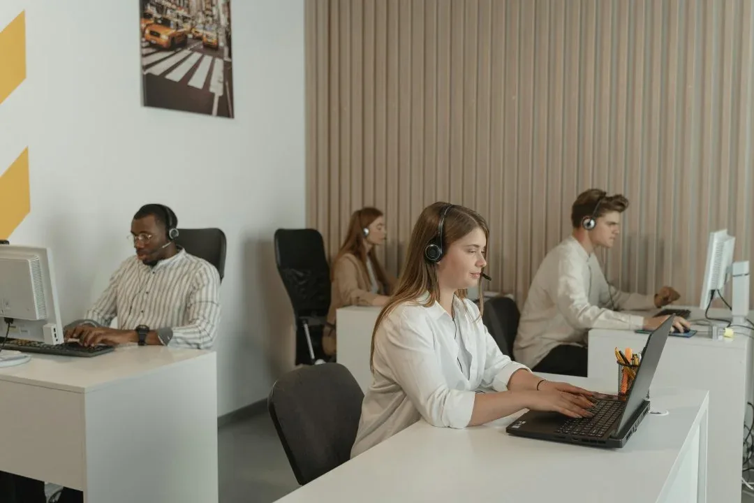 People working at laptops in a shared office